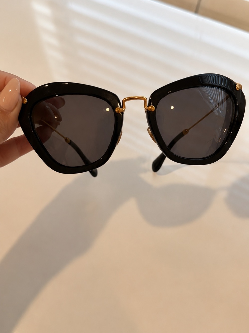 Miu Miu Classic Black Cat-Eye Sunglasses with Gold Accents